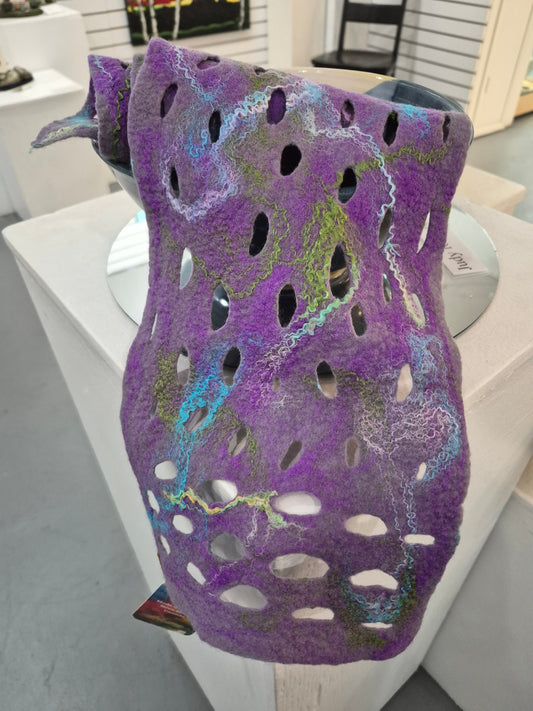 Lilac openwork scarf by Denise Uebele with blue, green, and pale decorative accents