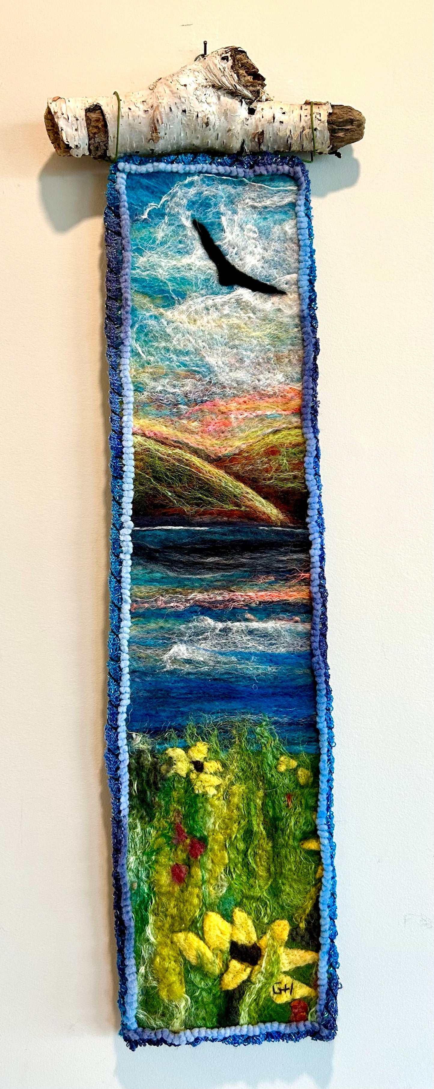 Out the Window - wet-felted merino and silk wall hanging by Gail Heinze, 5x19 inches, hung from Nova Scotia driftwood
