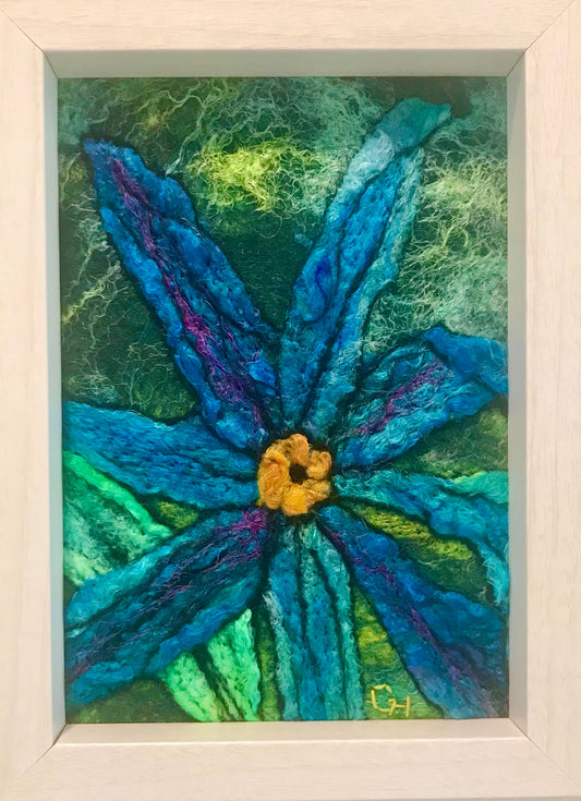 Blue Daisy – wet-felt fibre art by Gail Heinze, 4" x 6", framed